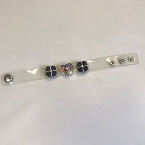 Clear plastic bracelet with bejeweled studs